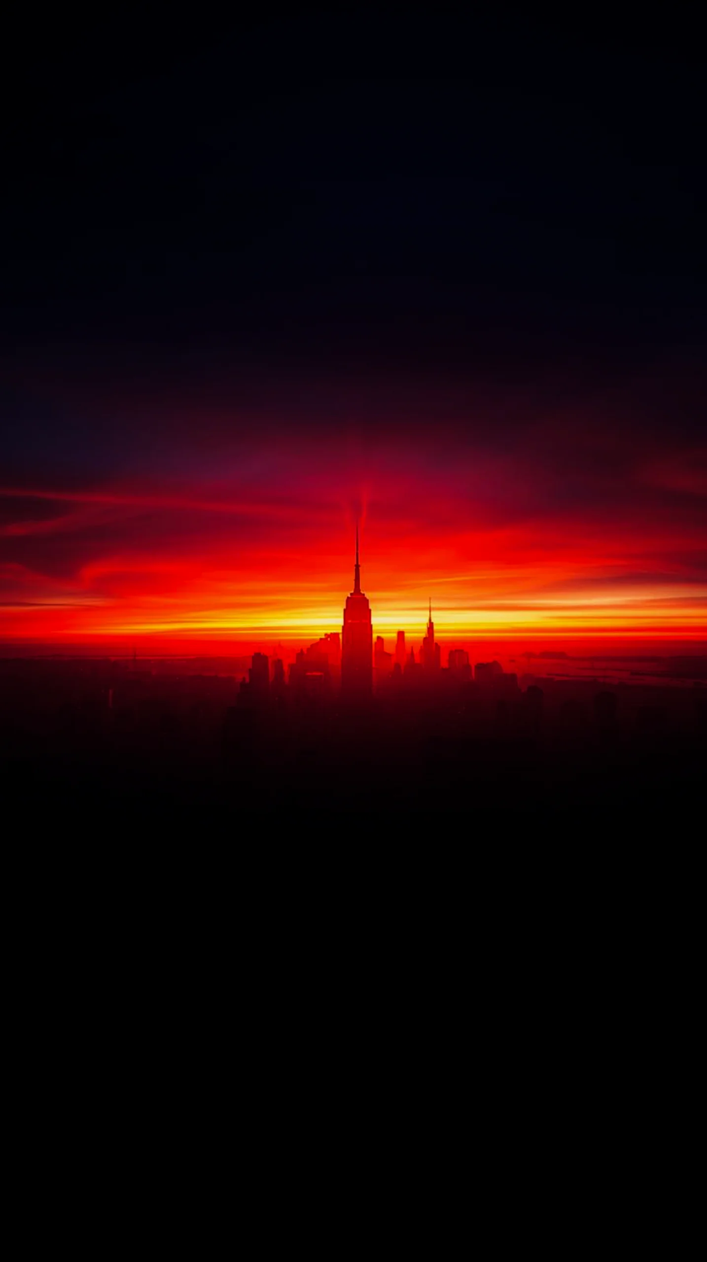 AMOLED wallpaper 4K for mobile featuring a dramatic sunset over a silhouetted city skyline.