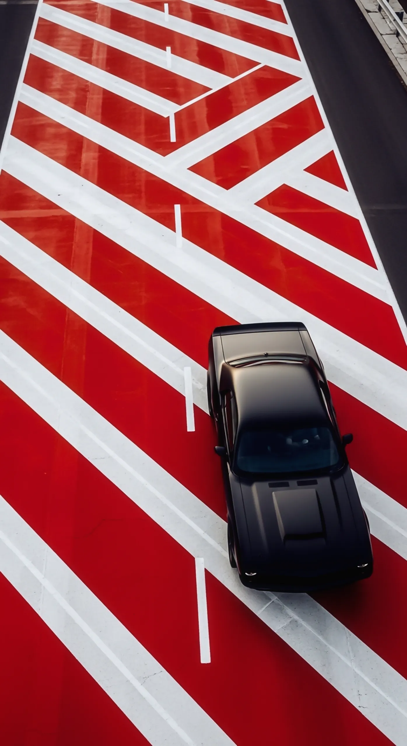 Black muscle car iphone wallpaper on red road, car wallpaper 4k for mobile, car wallpaper4k for mobile.