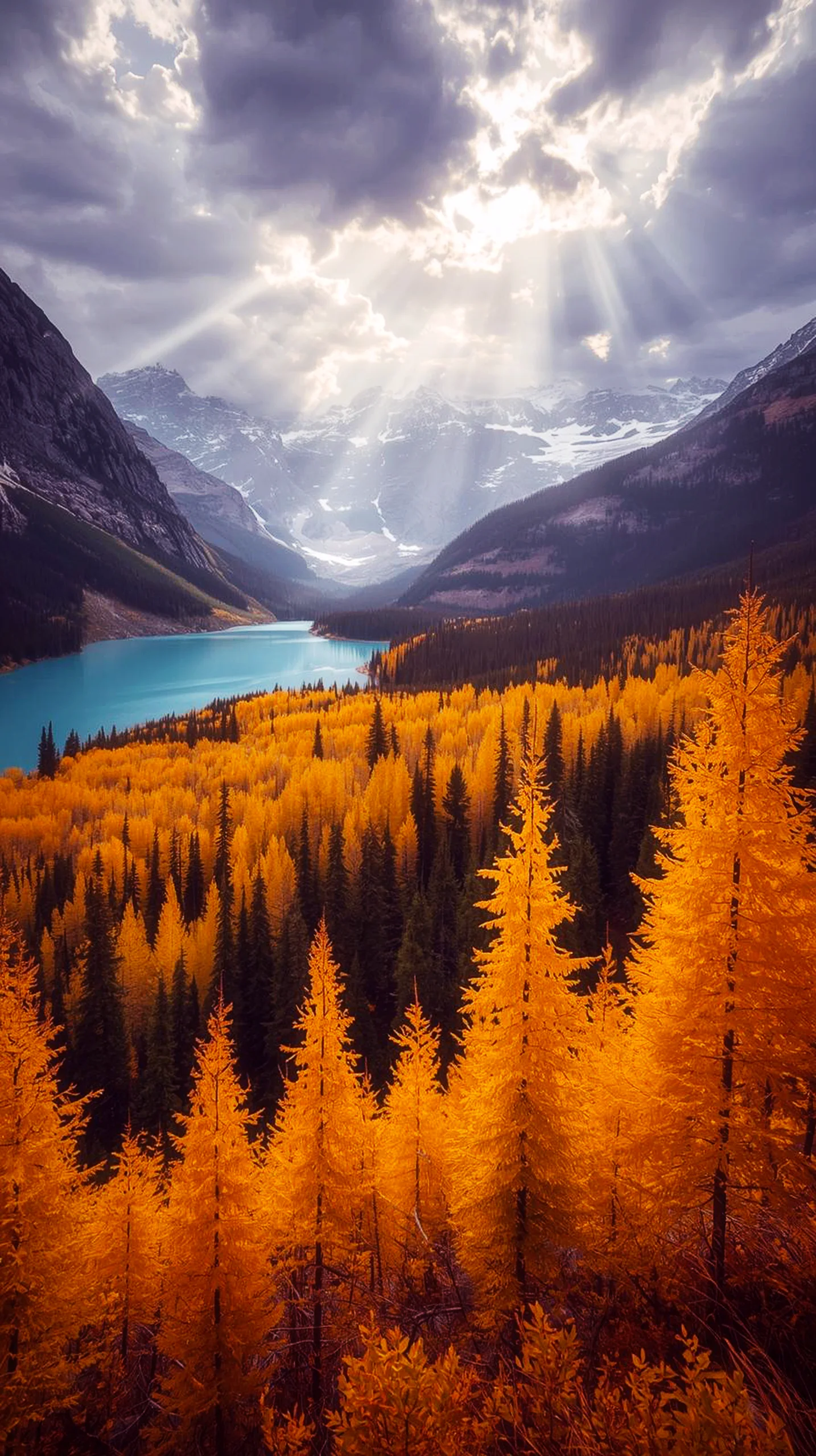4K iPhone wallpaper of a breathtaking landscape with snow-capped mountains, a bright blue lake, and a forest ablaze in