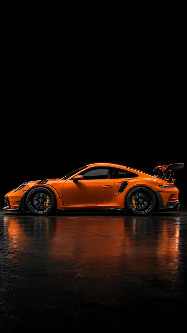 Vibrant Orange Porsche 911 GT3 RS Side Profile in Dark Studio Setting