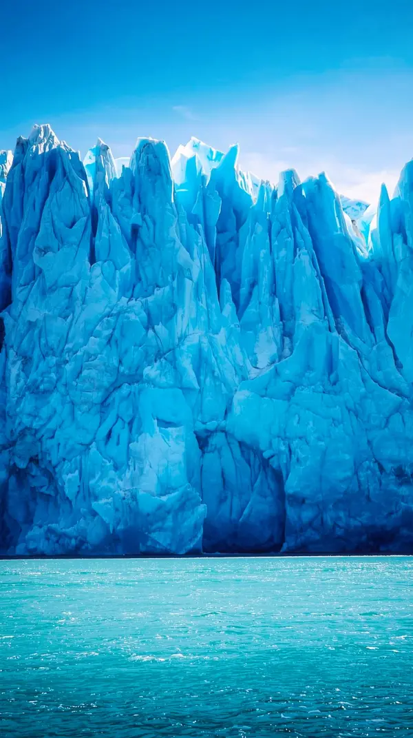 Glacier — Immense jagged ice wall, aqua foreground
