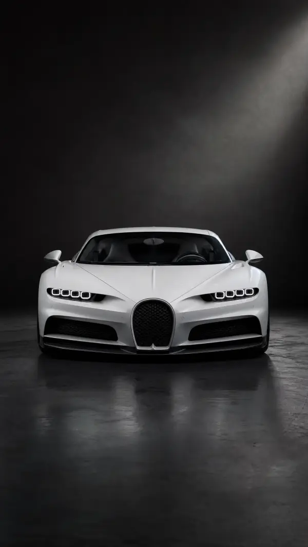 Sleek white Bugatti Chiron supercar in dark studio