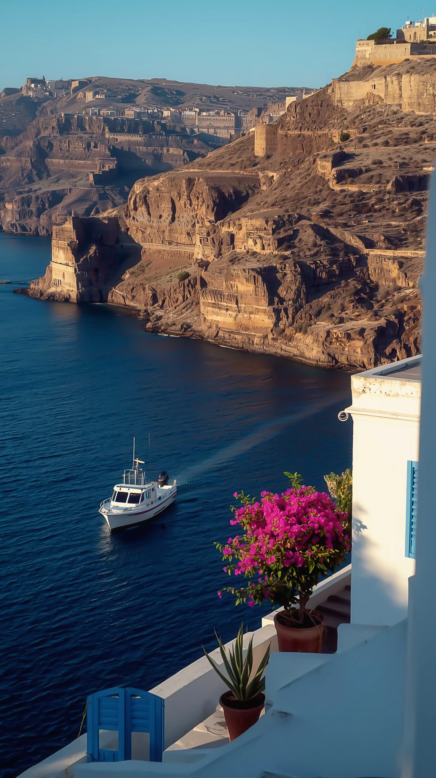 Idyllic Coastal Scene: Boat Cruising Past Santorini-like Cliffs