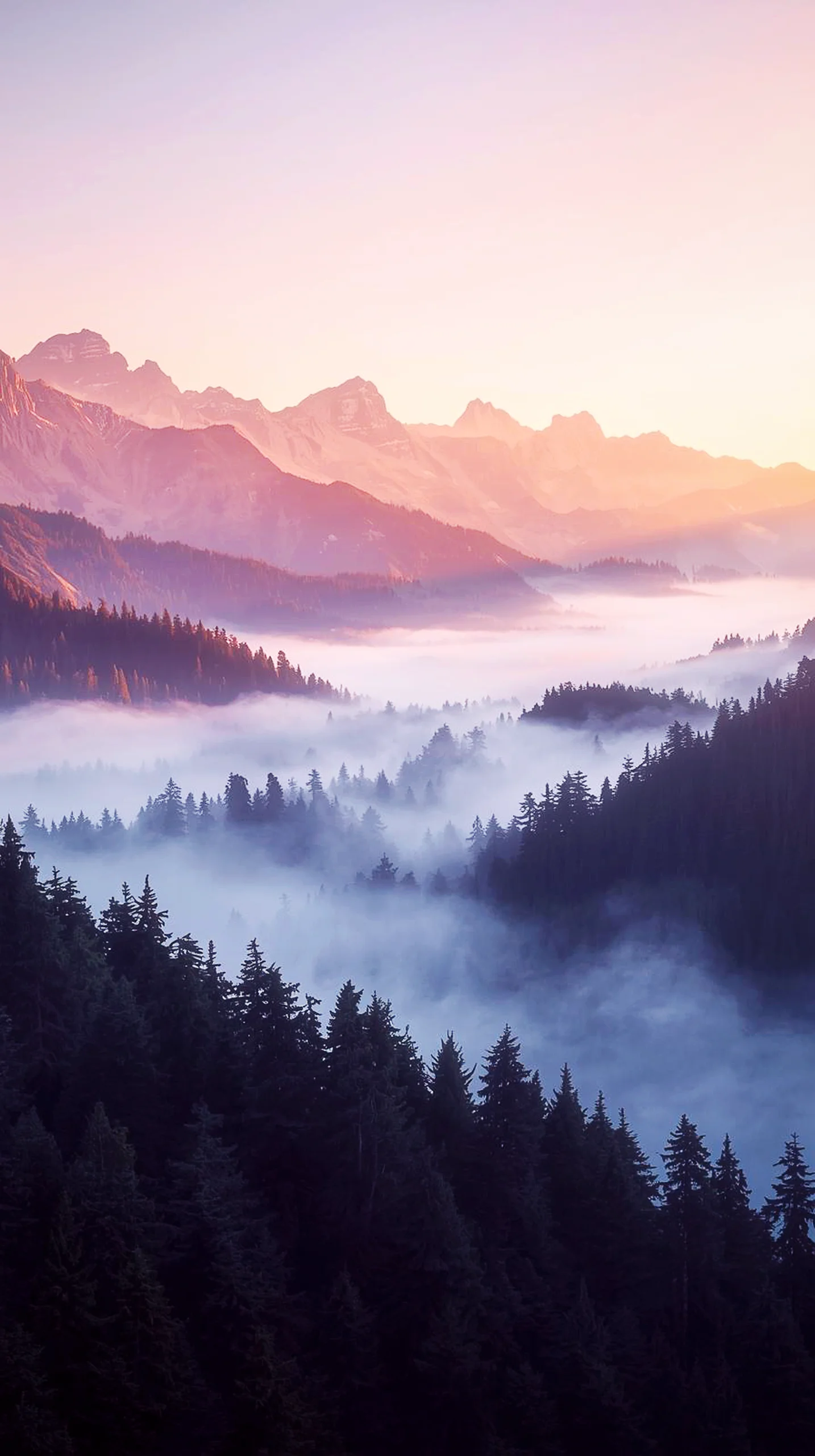 Misty mountain range at sunrise, perfect 4K wallpaper for mobile phones and iPhones.