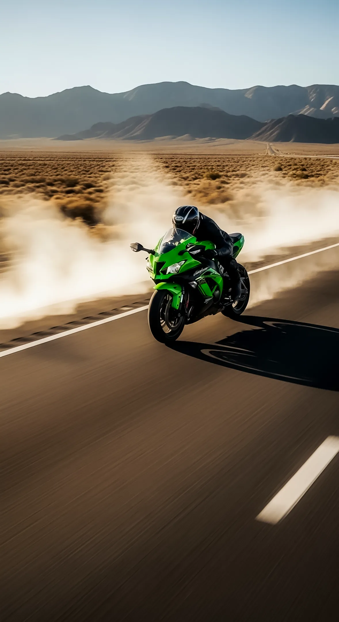 Green sportbike on dusty desert road. Great phone wallpaper, iphone wallpaper 4k, 4k wallpaper for mobile, 4k