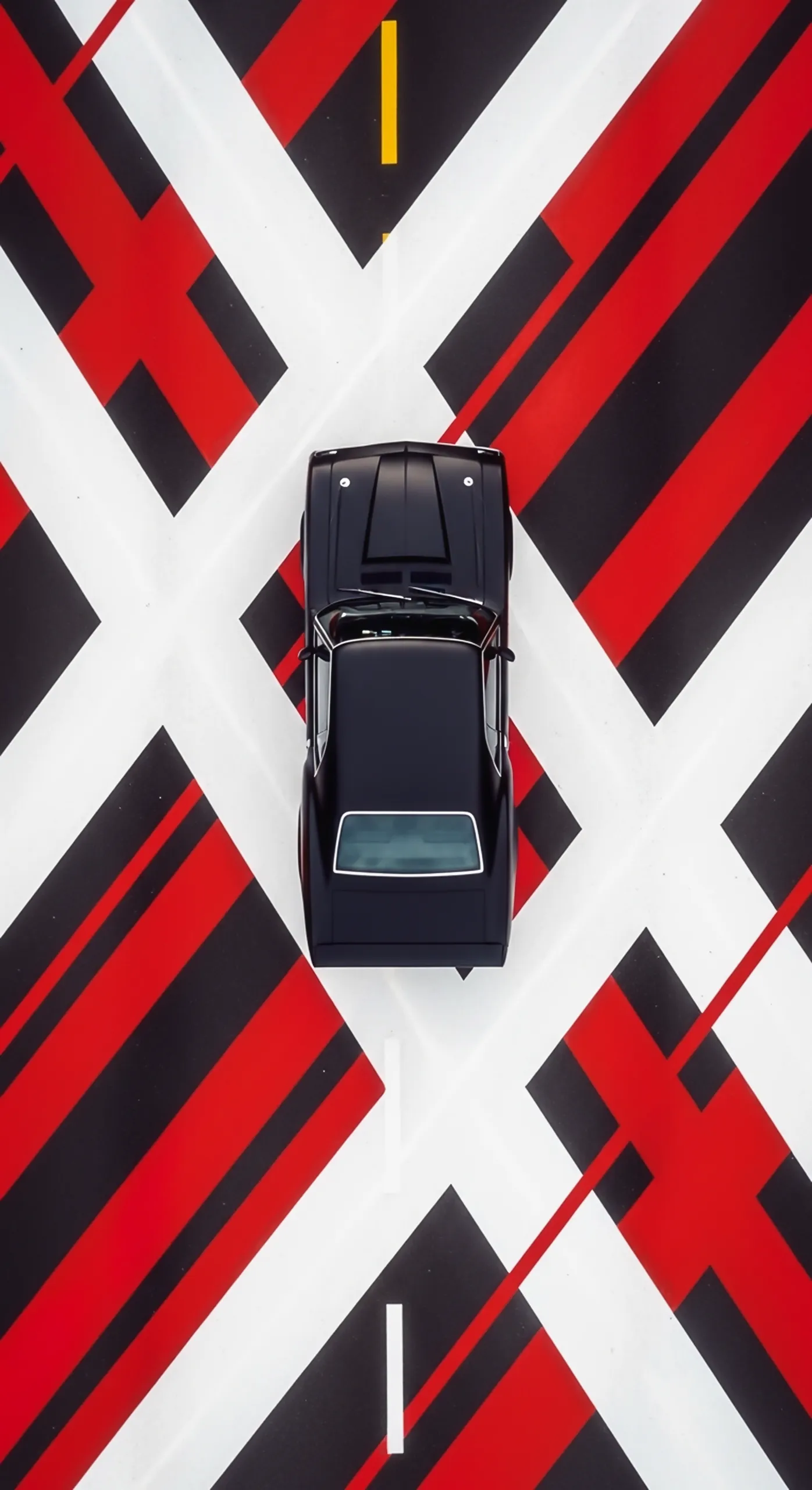 Top-down view of a black car on a red, black, and white geometric road, perfect car iphone wallpaper 4k for mobile.